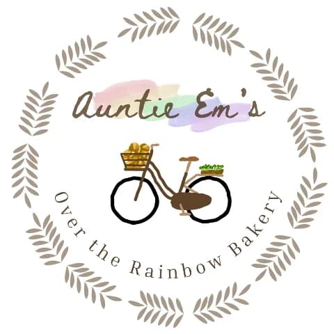 Auntie Em's Over the Rainbow Bakery logo